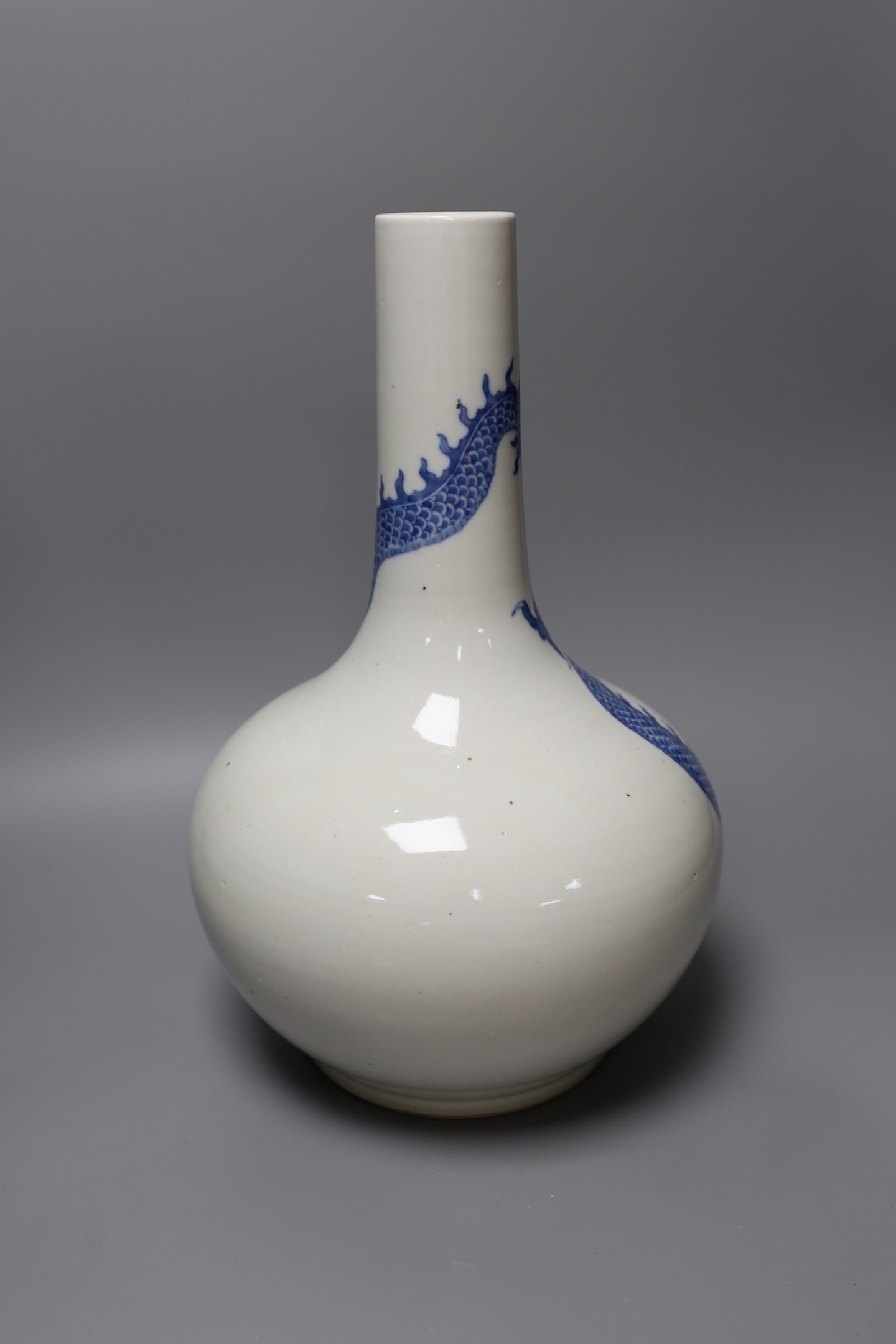 A Chinese blue and white dragon bottle vase, 37cm tall